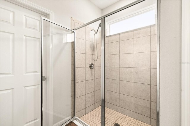 full bathroom featuring a shower stall