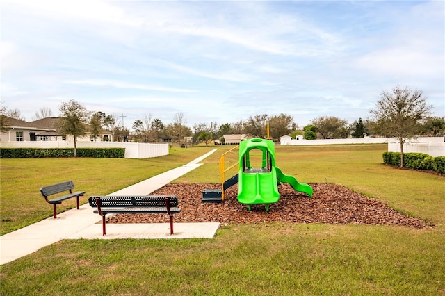 communal playground with a lawn