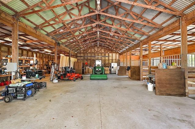 miscellaneous room featuring lofted ceiling and concrete floors