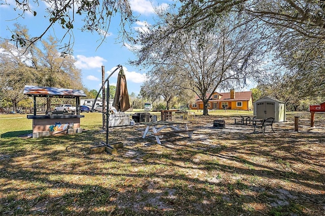 view of yard with an outbuilding and a storage unit