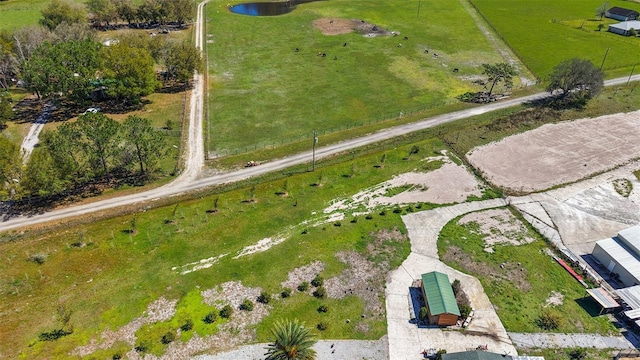 birds eye view of property featuring a rural view