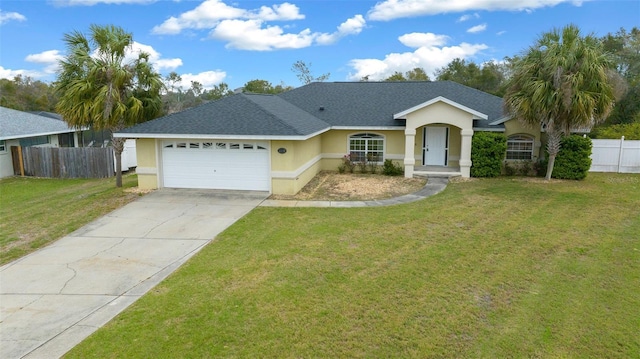 ranch-style house with a front yard, fence, an attached garage, stucco siding, and concrete driveway