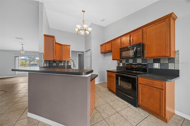 kitchen with black appliances, brown cabinetry, and dark countertops
