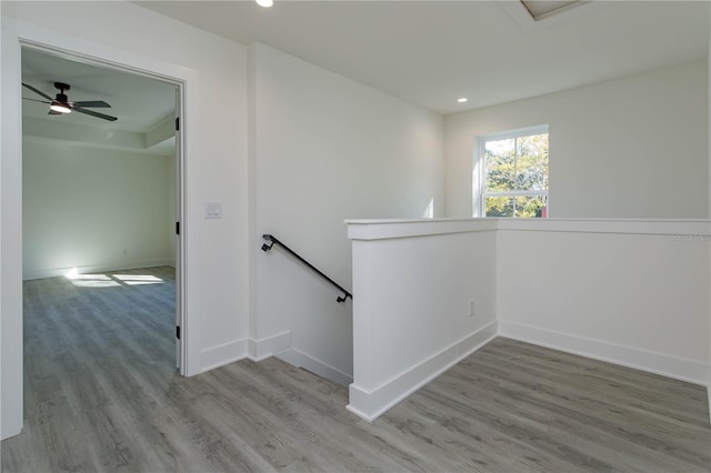 stairs featuring recessed lighting, baseboards, and wood finished floors