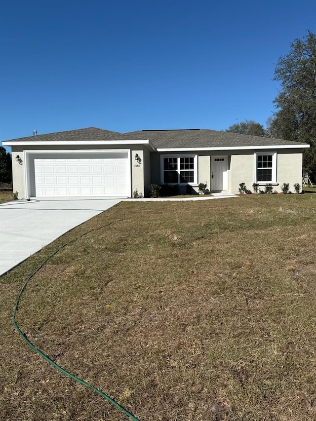 ranch-style house featuring concrete driveway, roof with shingles, an attached garage, a front lawn, and stucco siding