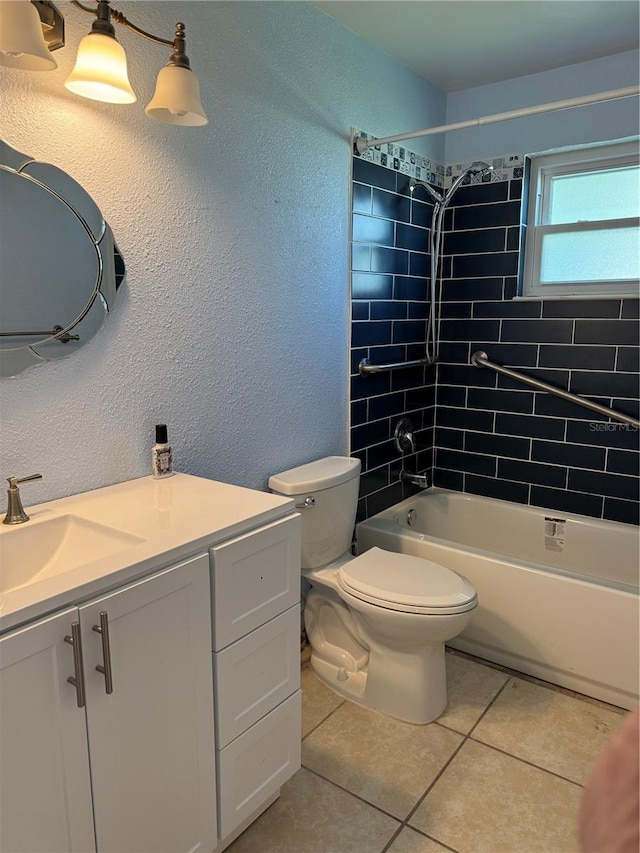 bathroom featuring a textured wall, shower / tub combination, tile patterned flooring, toilet, and vanity