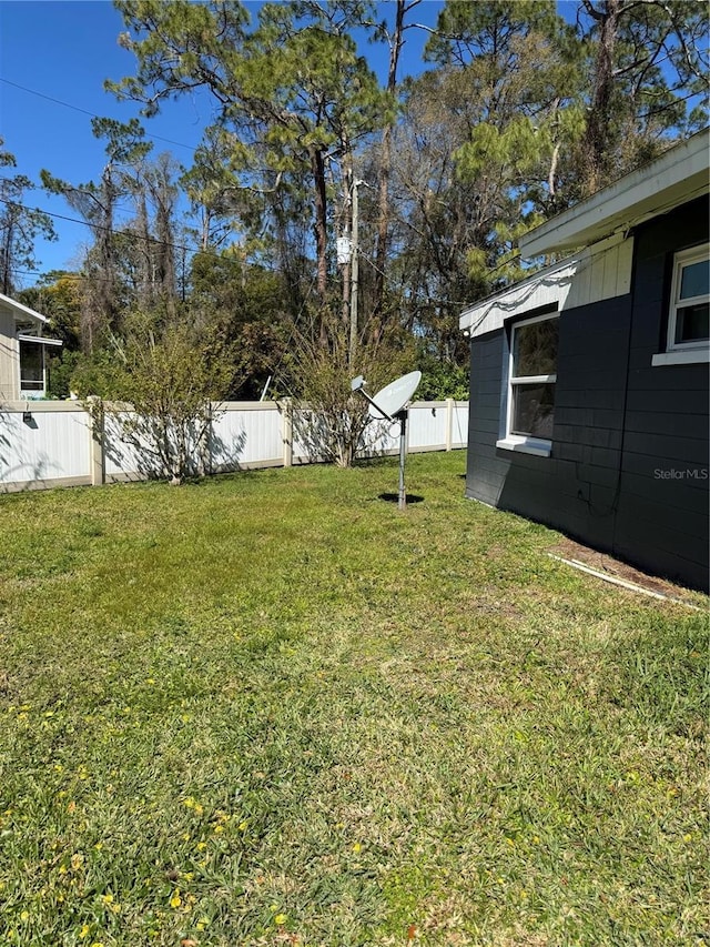 view of yard with fence