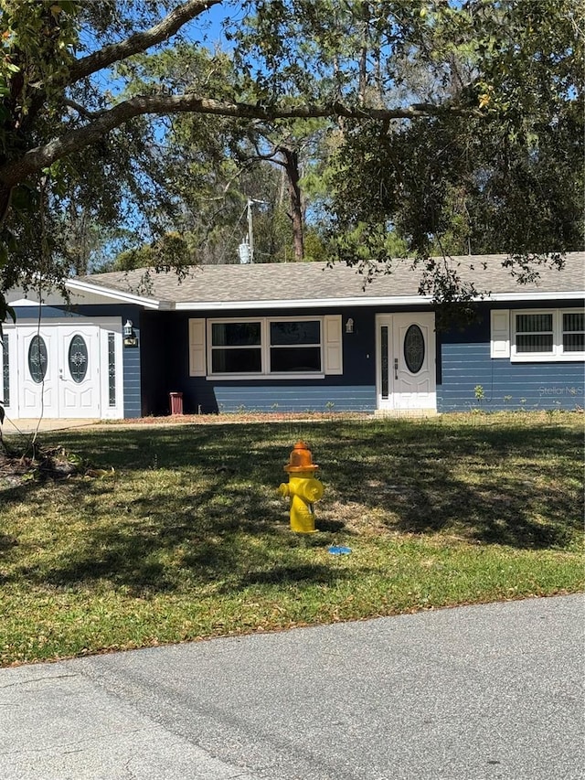 ranch-style house with a front yard