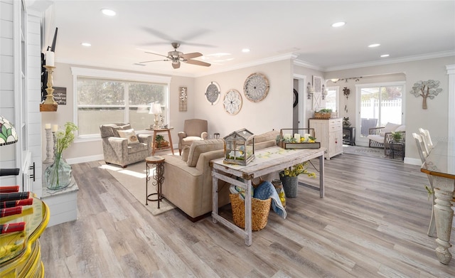 living area with baseboards, a ceiling fan, ornamental molding, light wood-type flooring, and recessed lighting