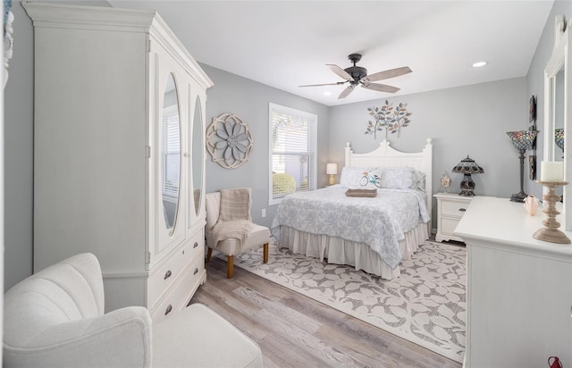 bedroom featuring light wood-type flooring, ceiling fan, and recessed lighting