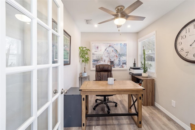 office featuring light wood-style flooring, recessed lighting, visible vents, baseboards, and a ceiling fan