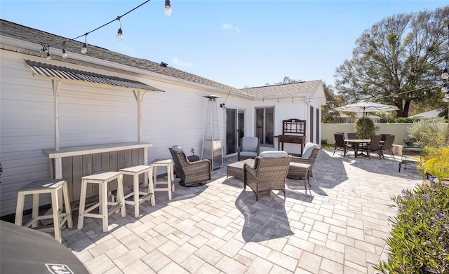 view of patio / terrace with outdoor dining area, outdoor lounge area, and fence