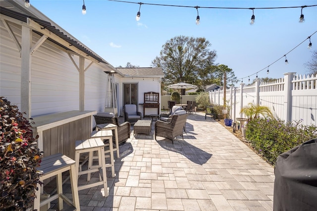 view of patio / terrace featuring outdoor lounge area, grilling area, and a fenced backyard