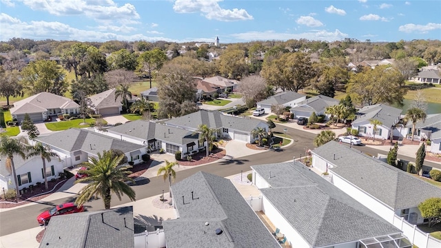 birds eye view of property with a residential view