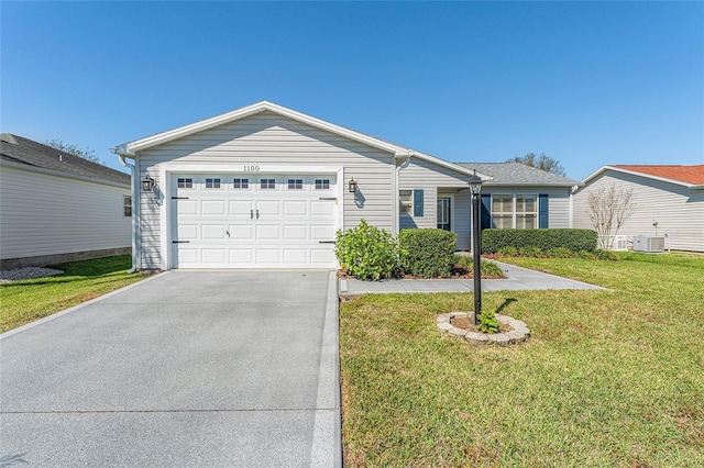 single story home featuring a front yard, central AC unit, concrete driveway, and an attached garage