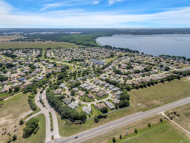 birds eye view of property with a water view and a residential view