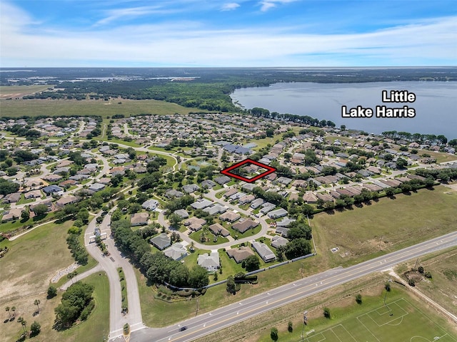 bird's eye view with a water view and a residential view