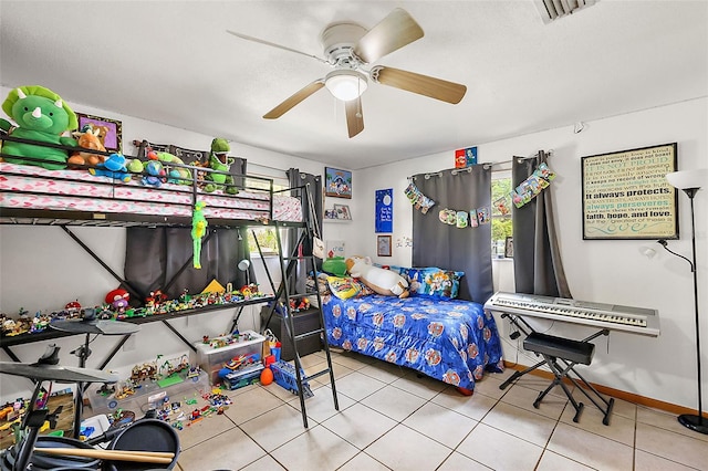 bedroom with visible vents, baseboards, ceiling fan, and tile patterned flooring