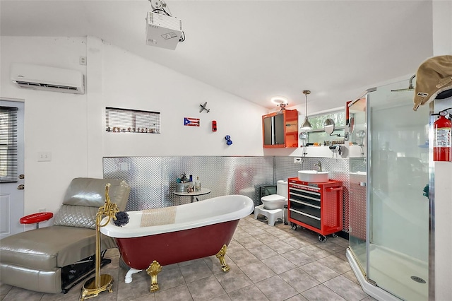 full bath with a soaking tub, lofted ceiling, a stall shower, tile patterned flooring, and an AC wall unit