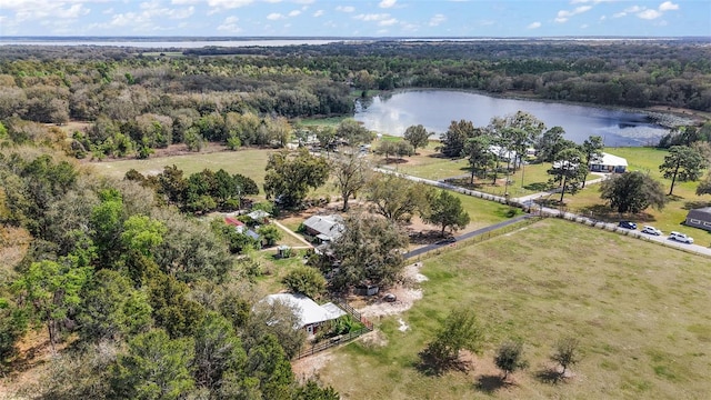 aerial view with a forest view and a water view