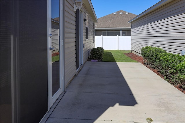 view of patio featuring fence