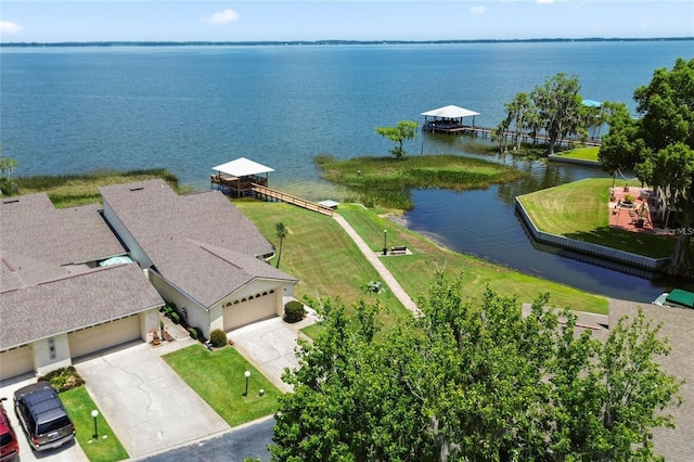 birds eye view of property with a water view