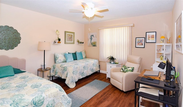 bedroom featuring ceiling fan and wood finished floors