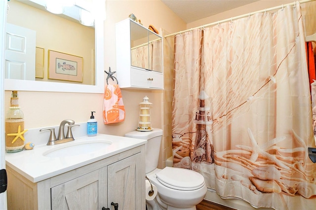 full bath featuring toilet and vanity