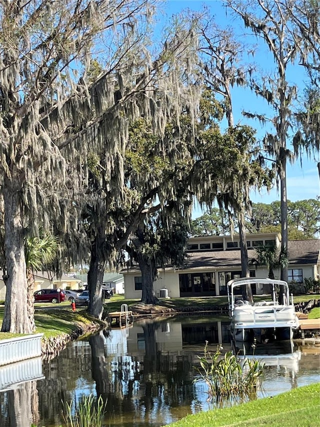 surrounding community with a water view