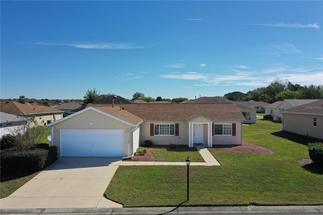 single story home featuring a front yard, a garage, and driveway