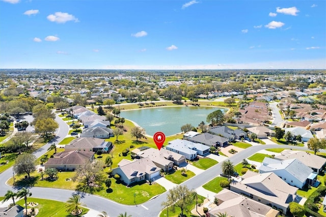 bird's eye view with a residential view and a water view