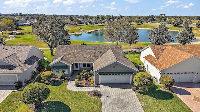 birds eye view of property with a water view