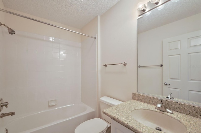 bathroom with shower / bathtub combination, a textured ceiling, toilet, and vanity