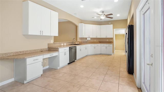 kitchen featuring recessed lighting, stainless steel appliances, a sink, and light countertops