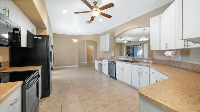 kitchen with visible vents, arched walkways, a ceiling fan, black appliances, and a sink