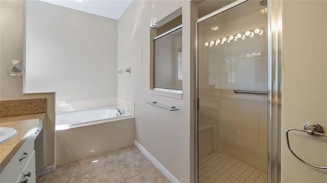 bathroom with tile patterned flooring, a garden tub, a shower stall, and vanity