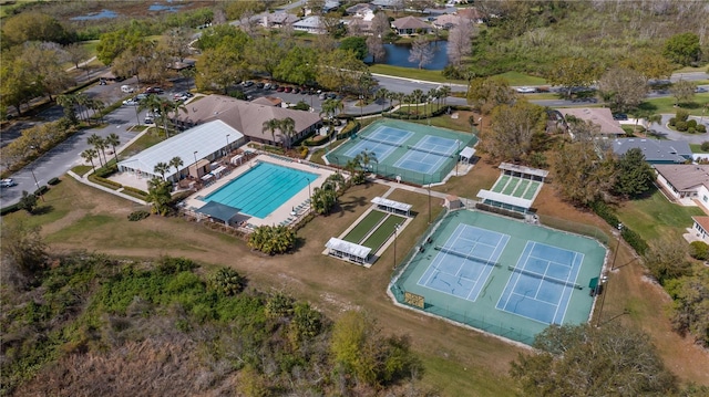 drone / aerial view with a residential view and a water view