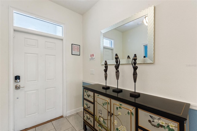 foyer with light tile patterned flooring