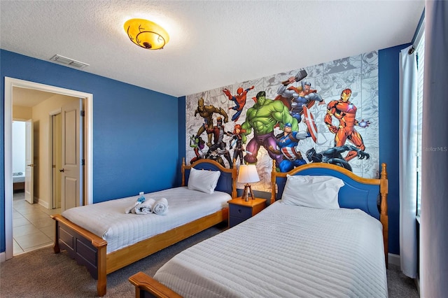 tiled bedroom featuring visible vents and a textured ceiling