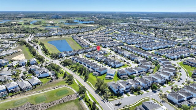 birds eye view of property with a water view, view of golf course, and a residential view