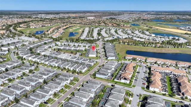 birds eye view of property featuring a residential view, a water view, and golf course view