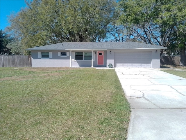 ranch-style home featuring a garage, brick siding, fence, concrete driveway, and a front lawn