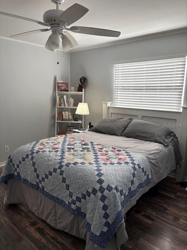 bedroom with a ceiling fan and wood finished floors