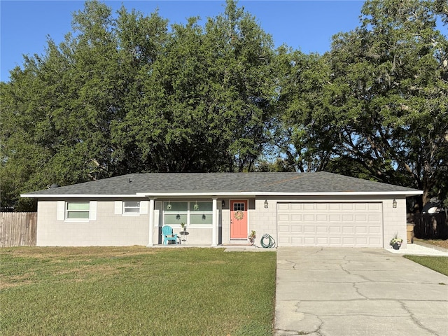2416 Briarwood Ln, Eustis, FL 32726 - ranch-style home featuring driveway, a front lawn, a garage, and fence