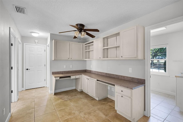 16017 Harbar Oaks Dr, Montverde, FL 34756 - kitchen with ceiling fan, open shelves, light tile patterned flooring, a textured ceiling, and baseboards