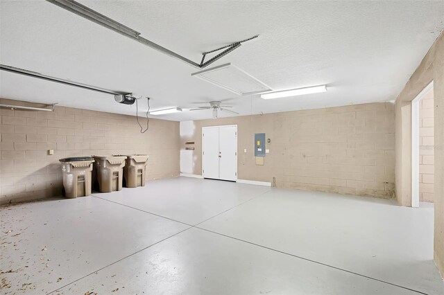 16017 Harbar Oaks Dr, Montverde, FL 34756 - garage with electric panel, a garage door opener, and concrete block wall