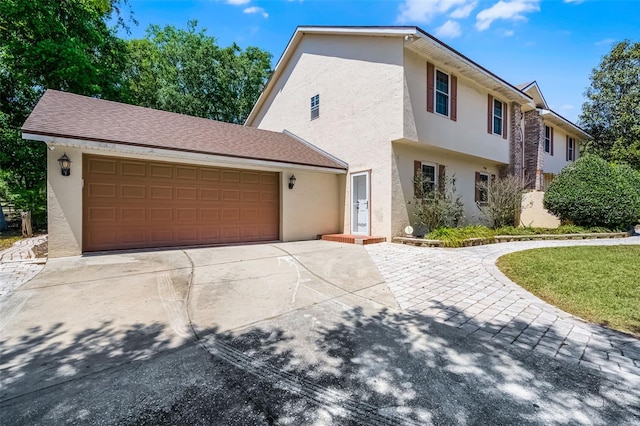 16017 Harbar Oaks Dr, Montverde, FL 34756 - view of front of property with concrete driveway, stucco siding, and an attached garage