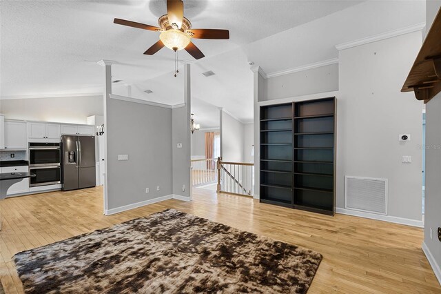 16017 Harbar Oaks Dr, Montverde, FL 34756 - unfurnished living room with lofted ceiling, ceiling fan, light wood finished floors, ornamental molding, and baseboards