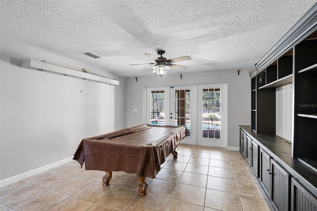 16017 Harbar Oaks Dr, Montverde, FL 34756 - playroom with french doors, a ceiling fan, light tile patterned floors, baseboards, and a textured ceiling