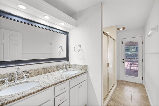 16017 Harbar Oaks Dr, Montverde, FL 34756 - full bath with tile patterned floors, a stall shower, double vanity, baseboards, and recessed lighting